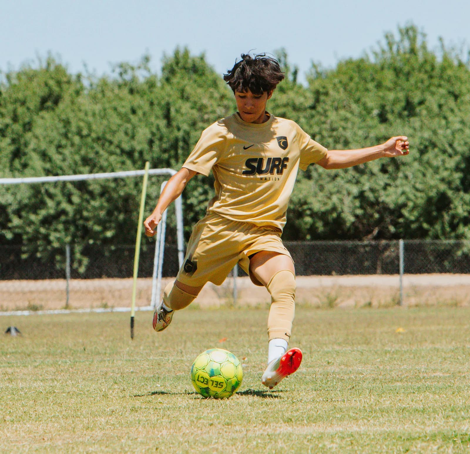 South Valley Surf boys player striking the ball at training