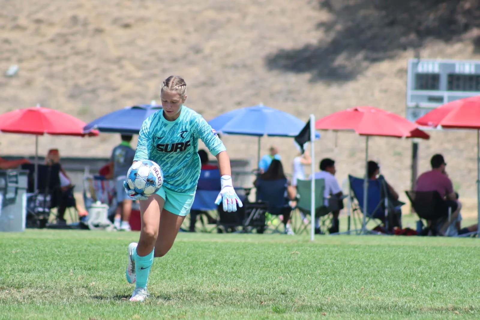 South Valley Surf goalkeeper rolling the ball out during a match at Coombs Sports Facility